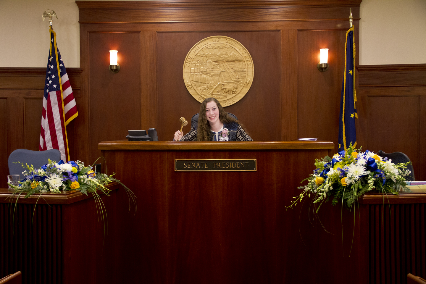 Sen. Stedman\'s daughter Susie poses in the Senate President\'s chair